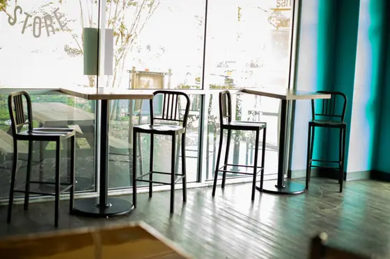 High-top tables by the front windows